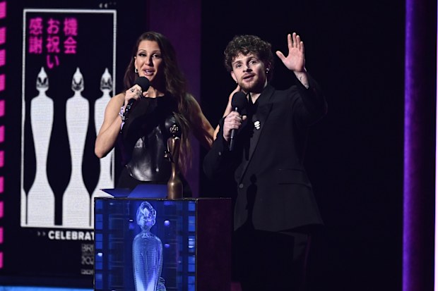 LONDON, ENGLAND - FEBRUARY 11: EDITORIAL USE ONLY Ellie Goulding and Tom Greenan on stage to present the award for Best New Artist during The BRIT Awards 2023 at The O2 Arena on February 11, 2023 in London, England. (Photo by Gareth Cattermole/Getty Images)