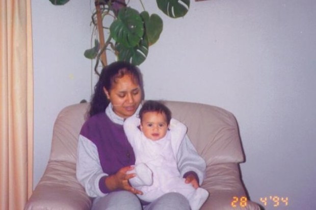 Sapphire Mitchell as a baby in her mum's lap.