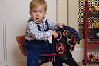 Prince Harry on a rocking horse in the playroom at Kensington Palace.
