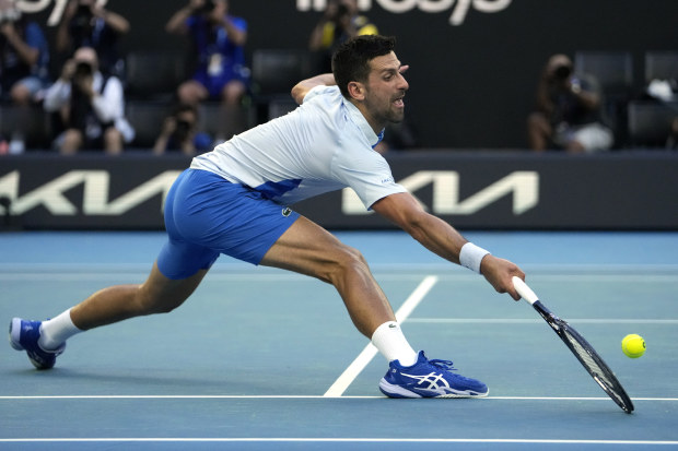 Novak Djokovic plays a forehand return to Taylor Fritz in his quarter-final match at the Australian Open.