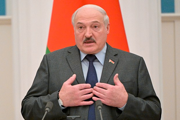 Belarusian President Alexander Lukashenko gestures during a joint news conference with Russian President Vladimir Putin following their talks in the Kremlin in Moscow, Russia, Friday, Feb. 18, 2022. (