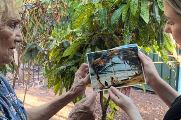 Linda shows Jess Beck a photo of Croker Island north of Darwin, where she and the other First Nations children were left behind.