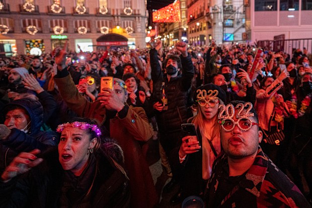 People celebrate during New Year's celebrations at Madrid's Puerta del Sol in downtown Madrid, Spain, early Saturday, Jan. 1, 2022