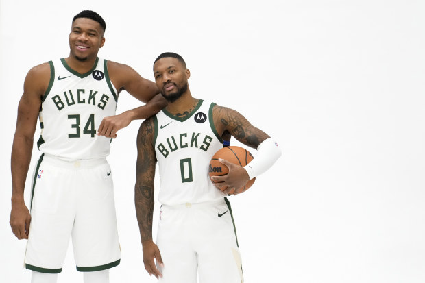 MILWAUKEE, WISCONSIN - OCTOBER 02: Giannis Antetokounmpo #34 and Damian Lillard #0 of the Milwaukee Bucks pose for portraits during media day on October 02, 2023 in Milwaukee, Wisconsin. NOTE TO USER: User expressly acknowledges and agrees that, by downloading and or using this photograph, User is consenting to the terms and conditions of the Getty Images License Agreement. (Photo by Patrick McDermott/Getty Images)