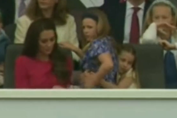 Princess Charlotte gives cousin Mia Tindall a squeeze during the Queen's Jubilee pageant parade.