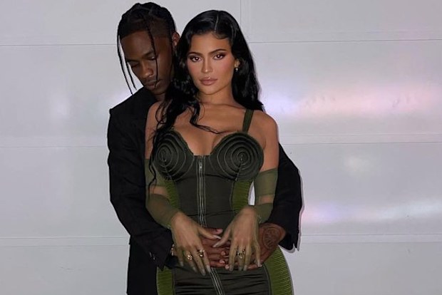 Travis Scott and Kylie Jenner post for cosy photo on Instagram.