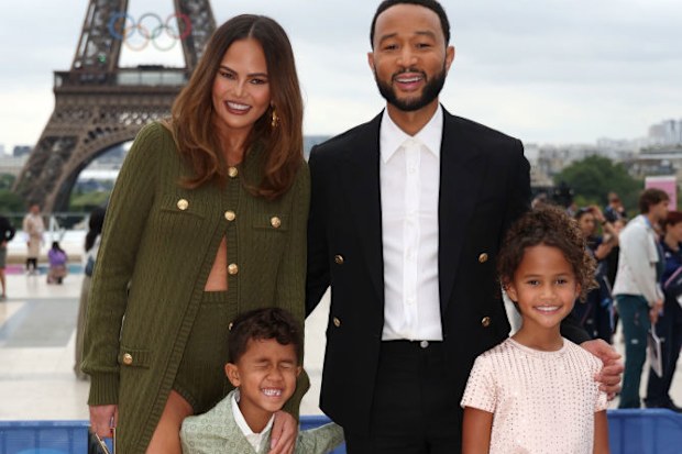 PARIS, FRANCE - JULY 26: Chrissy Teigen and John Legend attend with son Miles and daughter Luna the red carpet ahead of the opening ceremony of the Olympic Games Paris 2024 on July 26, 2024 in Paris, France. (Photo by Matthew Stockman/Getty Images)