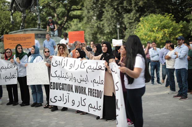 Dozens of members of Toronto's Afghan community held a protest at Queens Park in Toronto on Sunday, August 13. According to the demonstrators, the Taliban regime is brutalizing women in Afghanistan.   (Photo by Sayed Najafizada/NurPhoto via Getty Images)