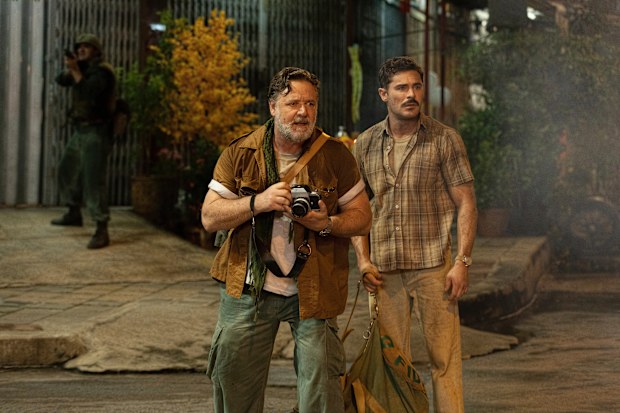 This image released by Apple TV+ shows Russell Crowe, left, and Zac Efron in a scene from The Greatest Beer Run Ever.