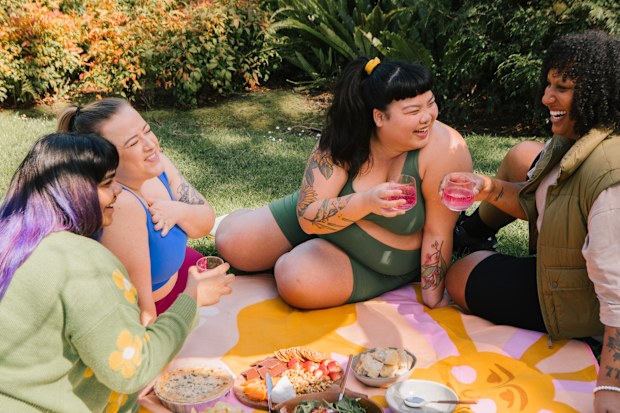 Friends posing together, outdoors, picnic