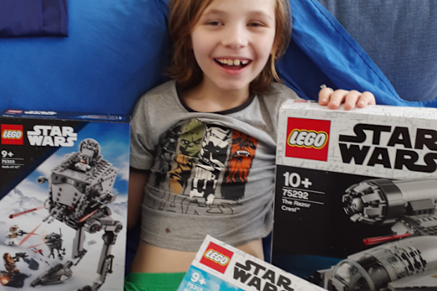 Rebecca's son, Oscar, with his Star Wars gifts a stranger sent after learning about the family losing everything during the Lismore floods.