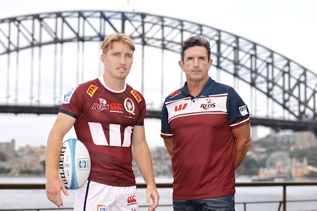 Tate McDermott of the Queensland Reds poses with defence coach Phil Blake.