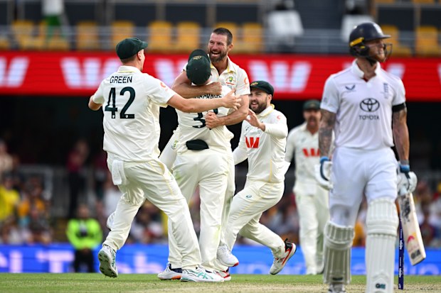 BRISBANE, AUSTRALIA - DECEMBER 07: Michael Neser of Australia celebrates with team mates after taking the wicket of Ben Stokes of England during day four of the Second 2025/26 Ashes Series Test Match between Australia and England at The Gabba on December 07, 2025 in Brisbane, Australia. (Photo by Bradley Kanaris - CA/Cricket Australia via Getty Images)