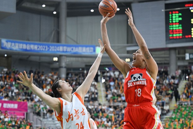 Elizabeth Cambage shoots the ball during Game 1 of WCBA league Finals. (Photo by Lian Zhen/Xinhua via Getty Images)