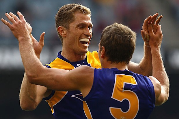 Adam Selwood celebrates a goal during the round 21 AFL match between the Melbourne Demons and the West Coast Eagles in 2011.