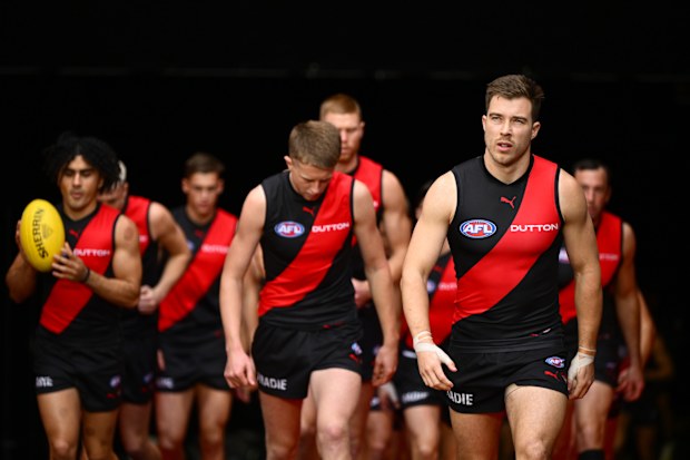 Zach Merrett leads his Bombers team out.