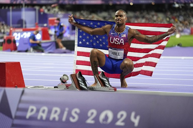Quincy Hall, of the United States, poses after winning the gold medal in the men's 400 meters final.