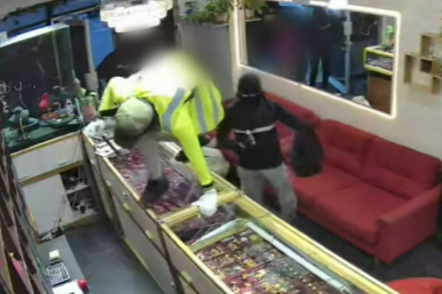 A business owner is in intensive care after his head was smashed in during a violent robbery in Queensland.
