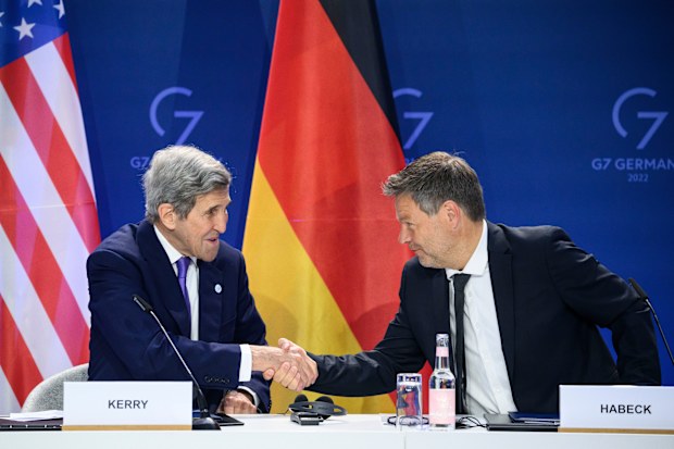 German Economy and Climate Minister Robert Habeck, right, and John Kerry, left, Special Envoy of the U.S. President for Climate, shake hands after they signed a declaration of intent to establish a German-American climate and energy partnership between the United States of America and Germany at the meeting of the G7 Ministers for Climate, Energy and Environment in Berlin, Germany, Friday, May. 27, 2022 