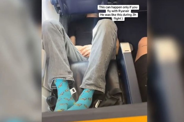 passenger sleeping on ryanair plane