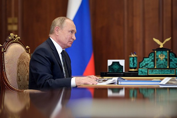 Russian President Vladimir Putin attends a meeting the Kremlin in Moscow, Russia.