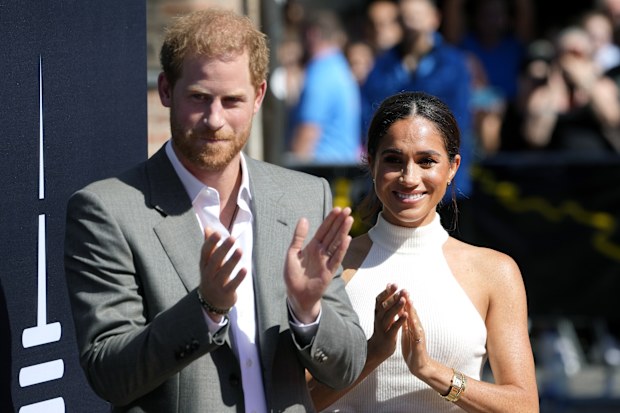 Britain's Prince Harry,, left, and Meghan, Duchess of Sussex, arrive for a visit at the town hall in Duesseldorf, Germany, Tuesday, Sept. 6, 2022. Prince Harry visits the city as ambassador for the Invictus games, a week-long games for active servicemen and veterans who are ill, injured or wounded, hosted by Duesseldorf next year. (AP Photo/Martin Meissner)