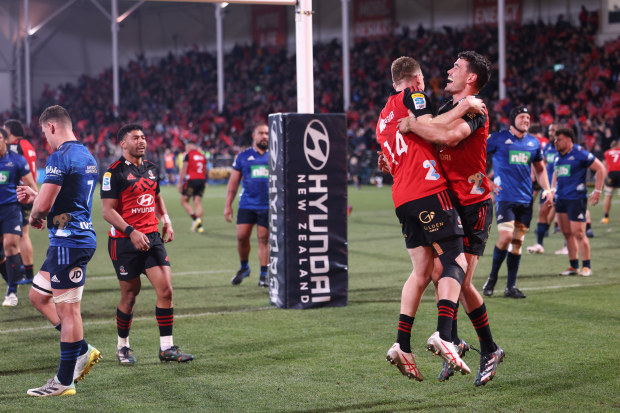 Dallas McLeod and Will Jordan of the Crusaders celebrate a try during the Super Rugby Pacific semi final.