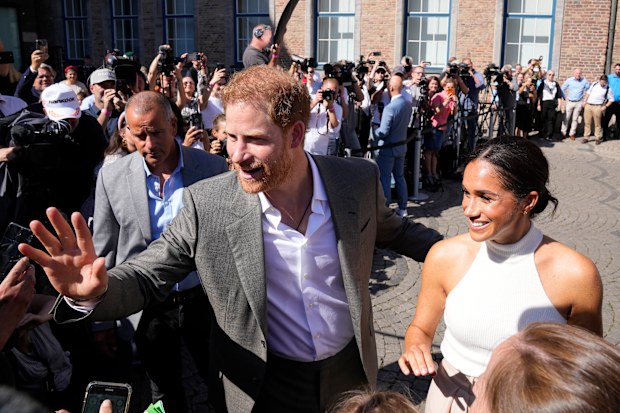 Prince Harry and Meghan, Duchess of Sussex, meet people after a visit at the town hall in Duesseldorf, Germany, Tuesday, September 6, 2022. 