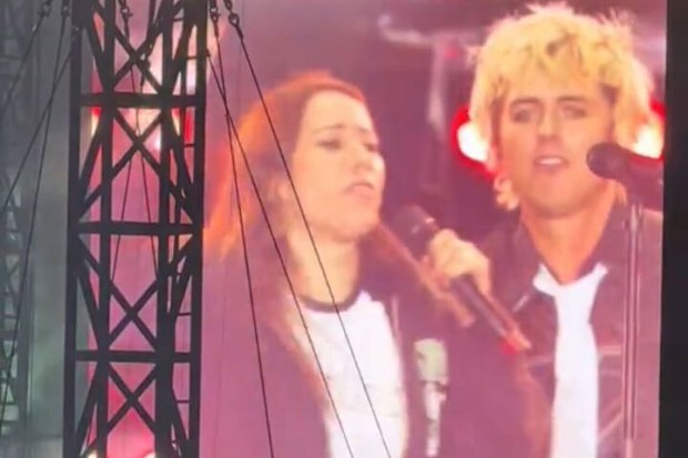 Shock moment Green Day fan grabs the microphone out of Billie Joel Armstrong's hands during Sydney show