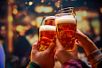 Close up shot of unrecognizable group of friends saying toasts and drinking beer and clinking glasses in bar while watching match. Concept of Oktoberfest, party, celebration, national traditions.