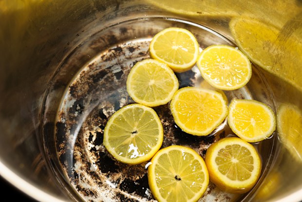 Sliced Lemons Inside Of A Burnt Cooking Pot