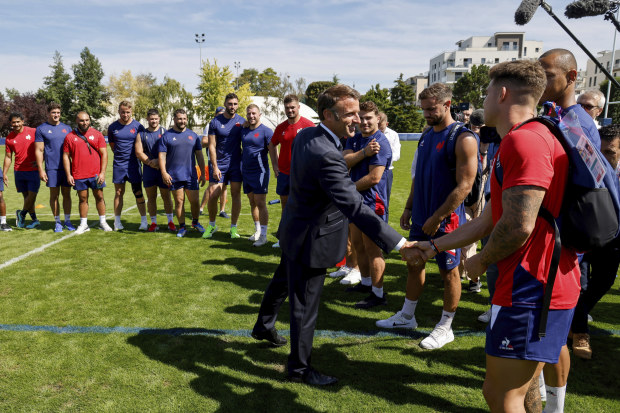 France's president Emmanuel Macron met his country's rugby squad at their base camp training center in Rueil-Malmaison, outside Paris.