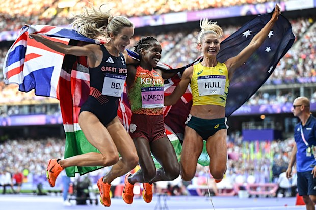 From left: Great Britain's Georgia Bell, Kenya's Faith Kipyegon and Australia's Jessica Hull jump for joy.