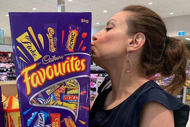 Jo Abi kissing a chocolate box