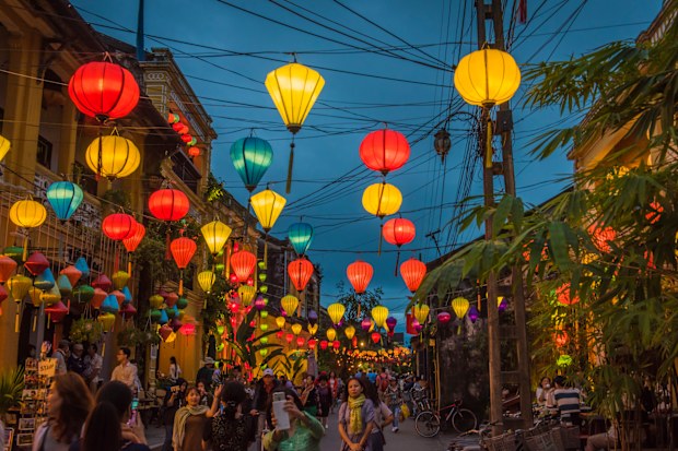 Bright Lanterns hanging over the walking street, in the ancient of Hoi An.