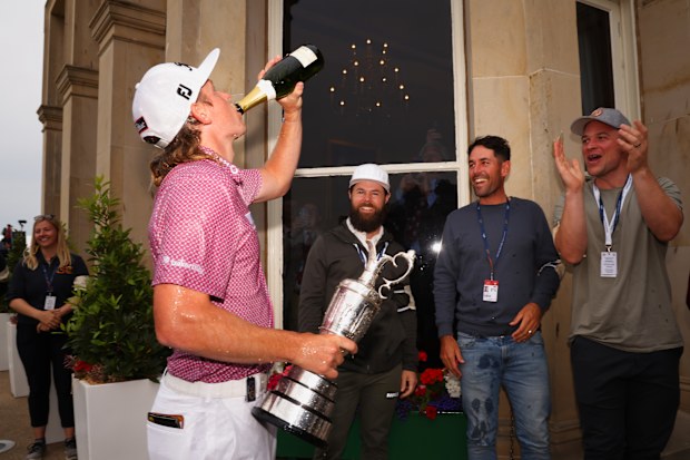 Cameron Smith of Australia celebrates outside the R&A Clubhouse following victory at the 150th Open at St Andrews Old Course.