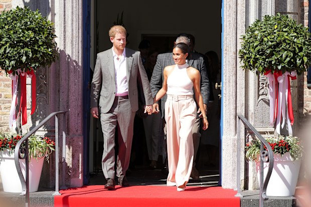 Prince Harry and Meghan, Duchess of Sussex, leave the town hall in Duesseldorf, Germany, Tuesday, September. 6, 2022. 