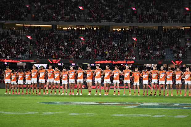 Giants and Bombers players paid tribute before the match.