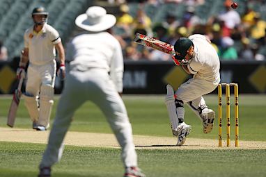 <b>Adelaide Oval was a sea of emotion as the First Test between Australia and India got underway.</b><br/><br/>Before the match fans honoured Phillip Hughes with 63 second of applause in a tribute to his final score when he was fatally injured after being struck by a bouncer at the SCG. <br/><br/>Hughes' Test number - 408 - was painted onto Adelaide Oval, while Australian players also had the number stitched onto their shirts under the coat of arms and there was a mountain of flowers and cricket bats paying respect to the late batsman at a memorial shrine.