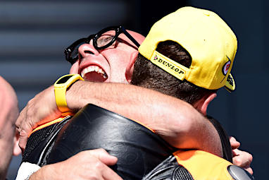 Alex Rins celebrates his Moto2 win with his team.