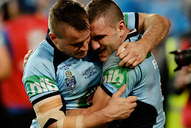 Farah and Josh Reynolds in an emotional embrace.