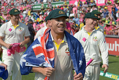 David Warner was draped in the Australian flag during a victory lap.