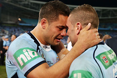 Hayne and Robbie Farah celebrate New South Wales' historic win.