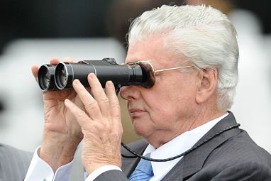 ...and in a typical pose watching one of his runners.
