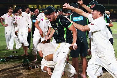 How sweet it is! Players happily soak each other in beer on the SCG pitch.