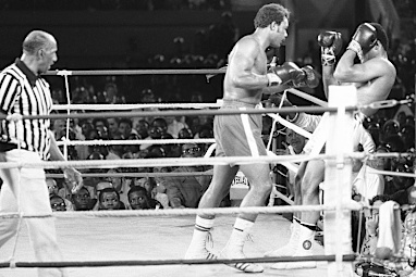 He also began to lean on the ropes and cover up, letting Foreman punch him.