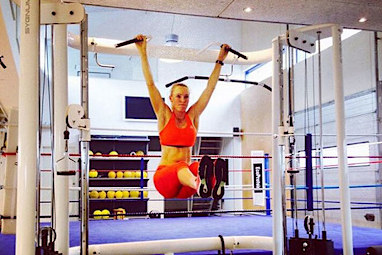 Danish tennis star Caroline Wozniacki sweats it out in the gym.