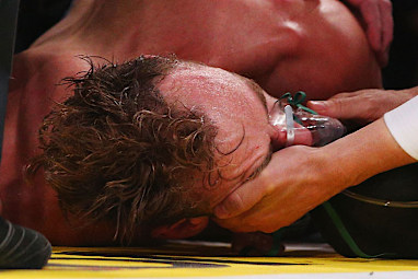 He was  taken out of the ring on a stretcher.
