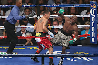 Maidana used his left forearm to push back Mayweather  in the 10th round.