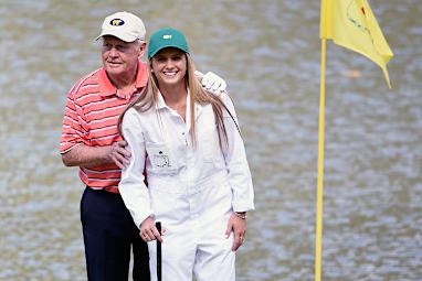 <b>Tennis star Caroline Wozniacki has unveiled a pink hairstyle while caddying for her fianc&eacute; Rory McIlroy during the Masters par three contest at Augusta. </b><br/><br/>Wozniaki attracted attention for more than just her hair colour, with the former tennis world No1 draining a long putt on the ninth hole. <br/><br/>Matt Jones was responsible for the major highlight after becoming the first Australian on debut at Augusta National to score a hole-in-one.<br/><br/>American Ryan Moore has the task of ending the curse after taking out the event, with no previous winner of the par-three going onto claim victory in the Masters.<br/><br/>